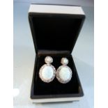 Pair of silver CZ and opal-set earrings