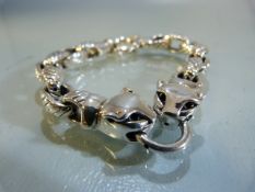 Silver linked bracelet with panther clasps