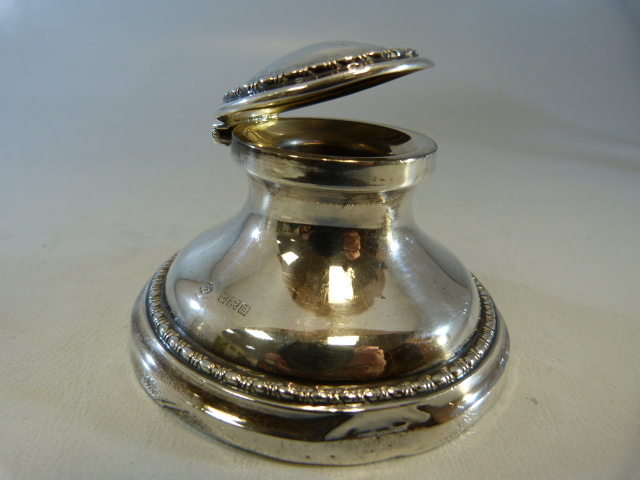 Hallmarked silver inkwell with hallmarked lid and oak bottom. Hallmarks for Birmingham.