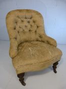 Button back nursing chair on turned wooden legs