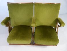 Pair of Folding 20th century cinema theatre seats with cast iron ends and green velour upholstery.