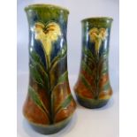 Pair of Art Nouveau Stoneware vases with single flower to front. Decorated in a drip glaze