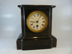 Slate mantle clock with white enamelled dial and Roman numeral Chapter ring. Maker mark rubbed