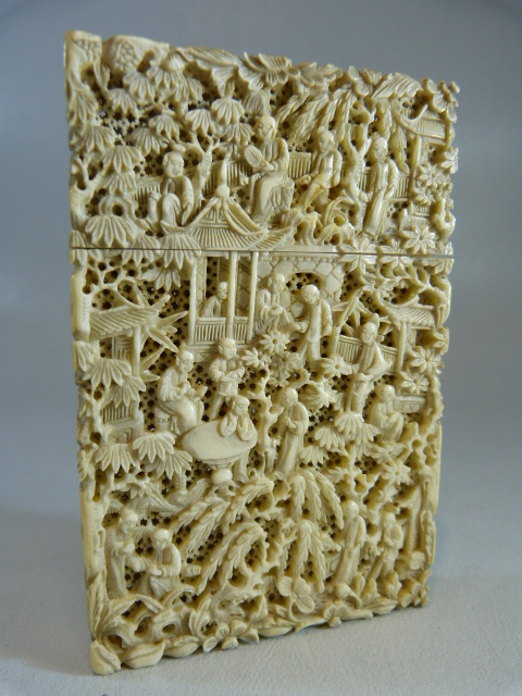 A 19TH CENTURY CHINESE CANTON IVORY CARD CASE, all sides decorated with detailed scenes of