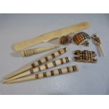 Carved bone African pendants, paper knife etc