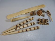 Carved bone African pendants, paper knife etc