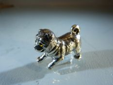 Silver figure of a puppy with glass eyes