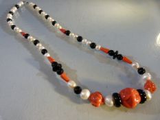 Freshwater pearl and coral-set necklace with silver clasp