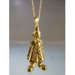 9ct Gold 18” fine POW Chain marked 375, from which hangs a ‘Clown’ Pendant. The articulated Clown is