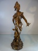 An Art Nouveau figural spelter gilt-painted, modelled as a femme fatale with flowing robes,