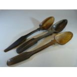 Three similar carved horn spoons with triangular bowls