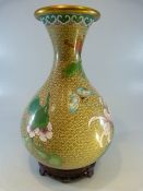 Cloisonne - a Good beige ground bulbous vase with trumpet neck decorated with flora and
