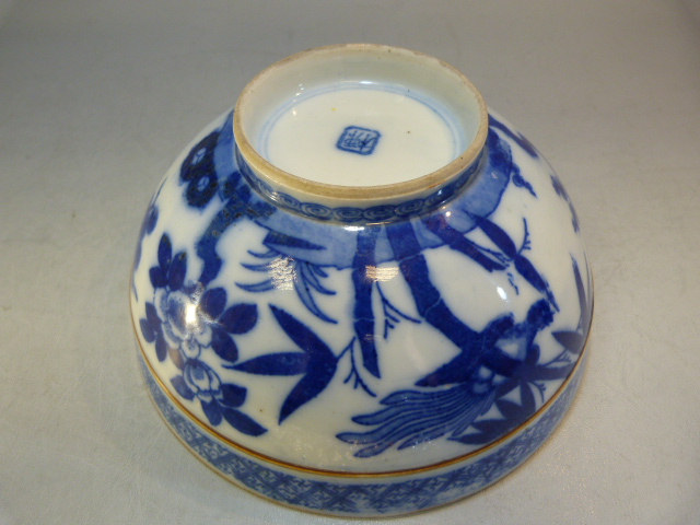 A Chinese bowl decorated in Blue and White with flowers and a two men in a sailing boat with a - Image 10 of 13