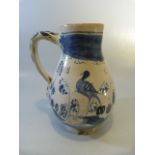 18th Century Dutch delft jug decorated in underglaze blue scenes of Pagoda's and a Liver type