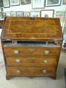 Edwardian mahogany and walnut fall front inlaid bureau. The fitted interior houses pigeon holes,