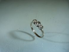 18ct White Gold 3 stone Diamond Trilogy Ring. The centre Old Brilliant cut Diamond is approx: 20cts,