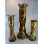 Trench Art - Three similar shell cases converted to vases with pinched middles - all mounted on