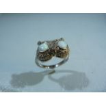 Unusual silver ring in the form of an owl with opal panelled eyes