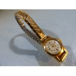 18ct gold Mu Du ladies cocktail wristwatch on an expanding Excalibur gold bracelet, dial marked 17