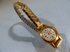 18ct gold Mu Du ladies cocktail wristwatch on an expanding Excalibur gold bracelet, dial marked 17