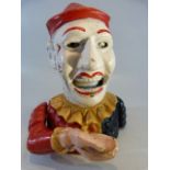 Cast iron money box in the form of a clown