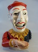 Cast iron money box in the form of a clown
