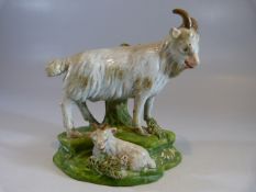 Early 19th Century staffordshire Goat and recumbent Kid on a naturalistic base