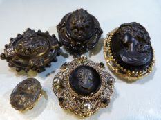 Collection of five Victorian hardstone mourning brooches