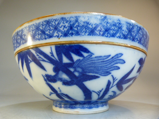 A Chinese bowl decorated in Blue and White with flowers and a two men in a sailing boat with a - Image 3 of 13