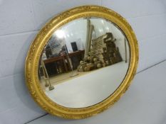 Gilt framed antique oval wall mirror