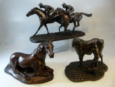 Three Bronzed resins of Racehorses - Recumbent horse, 'Flat Out' Heredities and a Girl grooming