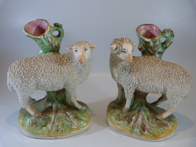 Staffordshire spill early vases - depicting sheep upon a rock. Decorated using pottery chips and