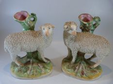 Staffordshire spill early vases - depicting sheep upon a rock. Decorated using pottery chips and