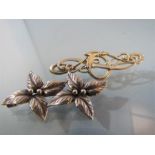 Two silver brooches - 1) Marked DENMARK JOHN L Sterling on the 'C' clasp this double leaf flower
