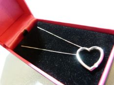 9ct white gold heart shaped pendant necklace inset with diamond