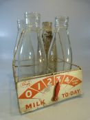 Milk Bottles - Shape Milk bottle carrier with four vintage glass milk bottles