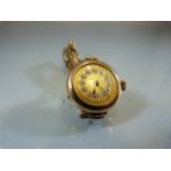 Ladies 9ct gold cased circular dress watch with expanding bracelt by J.H.W "9ct Gold /Metal