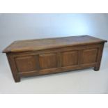Antique oak coffer with carved panels