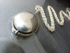 Silver (925) 1971 import mark, contemporary pendant with a polished oval convex centre. approx 35.