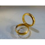 Two 22ct wedding bands (total weight approx 10.7g)
