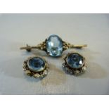 Hallmarked silver possibly designer 'Sterling brooch and earring set. Set with pale blue cut stone