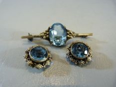 Hallmarked silver possibly designer 'Sterling brooch and earring set. Set with pale blue cut stone