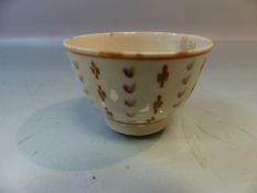 Miniature possibly Bow (unmarked) Sake cup. Decorated in underglaze Ochre, Green and Pink with