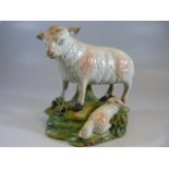 Early 19th Century staffordshire sheep and recumbent lamb on naturalistic base.