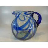 Large Baluster glass water jug with blue trailing glass through out. Applied Bristol blue coloured