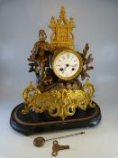 French Gilt Spelter mantle clock. The Gilt feet with Rococo scrolls and floral trails. Enamel