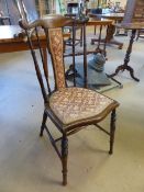 Antique mahogany side chair with turned wooden spindle back