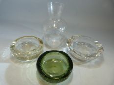 Two whitefriars bubble encased glass ashtrays and one other along with a bulbous shaped decanter