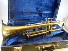 A vintage 20th Century trumpet / bugle with incised ' B&M Champion ' to the horn section, within a