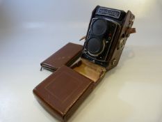 Rolleicord camera in leather case 1594705 along with matching leather case containing fittings